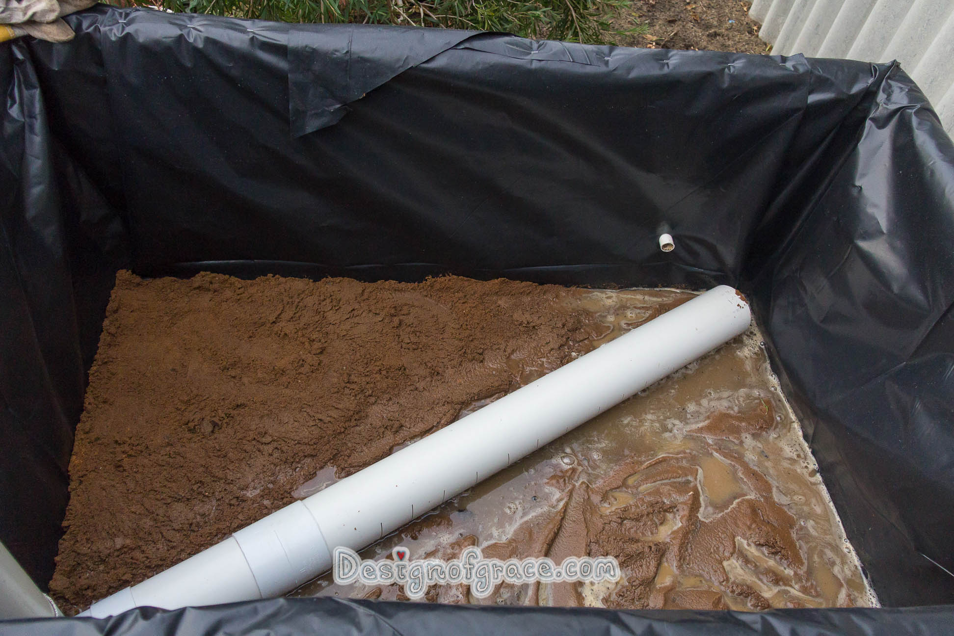 Overview of the sand layer in light of where the overflow pipe is.