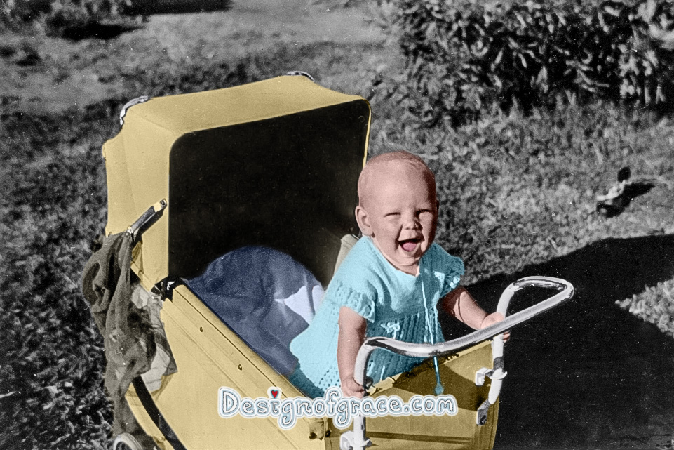 old black and white photo of a baby in the pram coloured by me