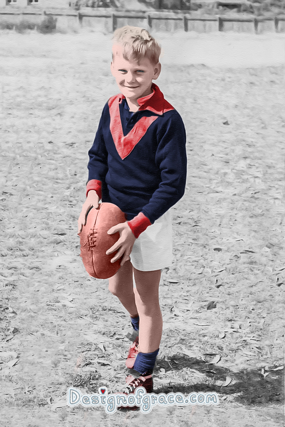 old black and white photo of a boy holding a football coloured in by me