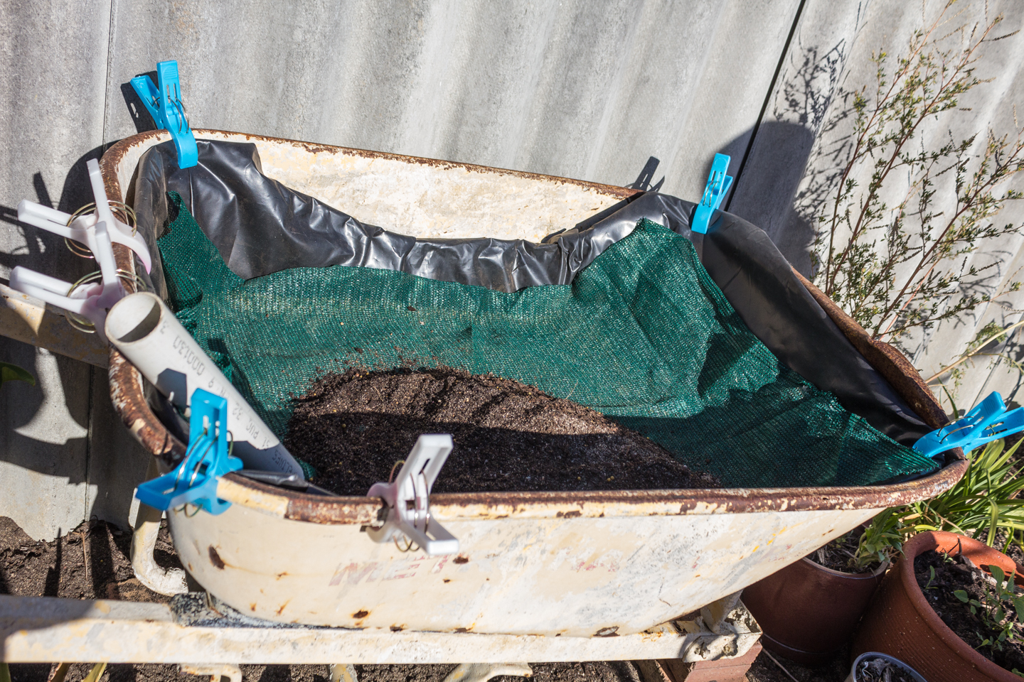 put in shade cloth to separate the reservoir layer from the soil layer.