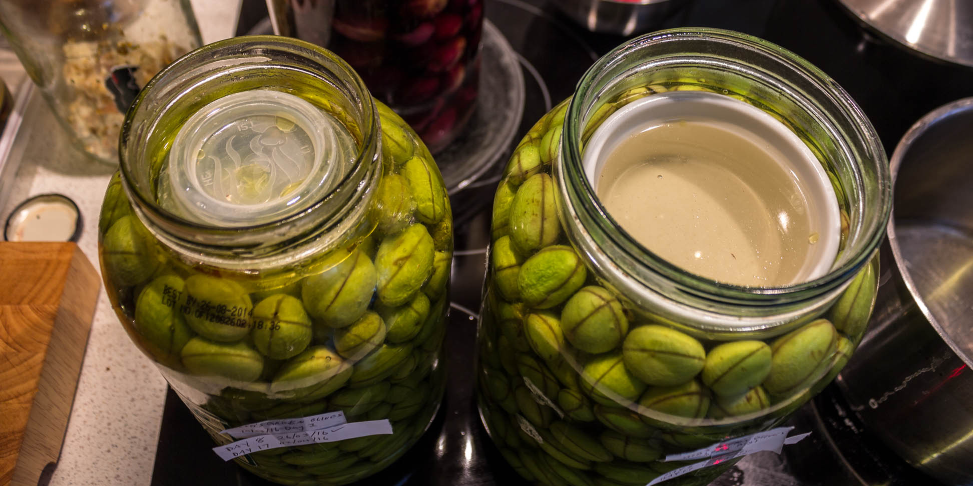 Olives in the jar with new brine solution.