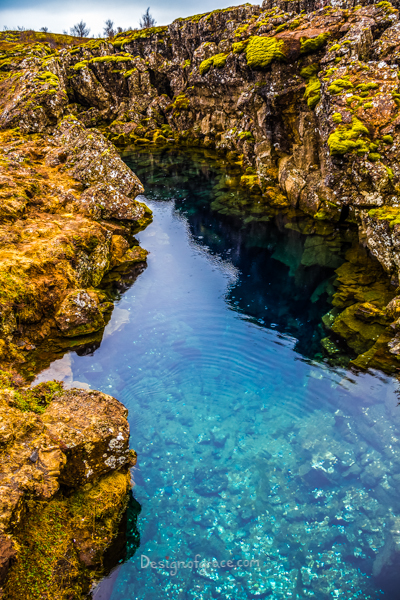 beautiful blue waters in a pool in Iceland surrounded by rock structures