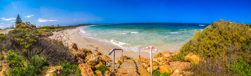 Hopetoun Beach Panorama with clear blue skies and turquoise waters with yellow rocks on the left and right with steps leading down to the beach , Ravensthorpe, Western Australia