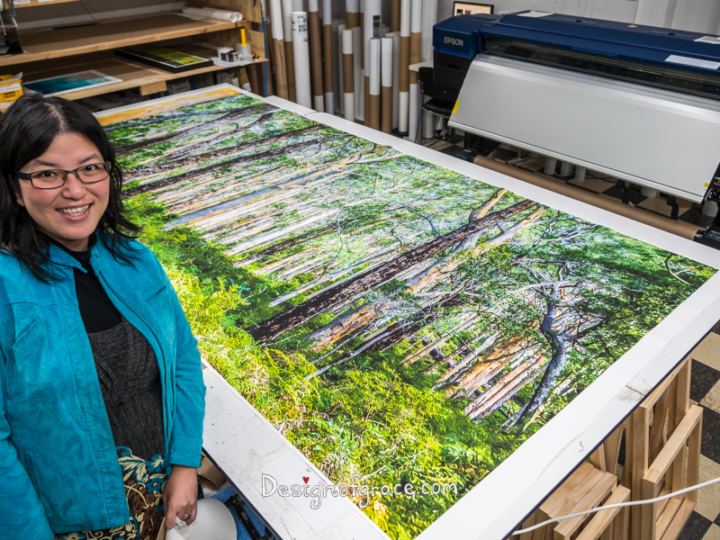 Me next to a massive 3 x 1.4m canvas of the Karri Forest for my client before it's being stretched