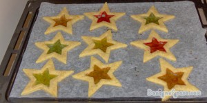A tray of baked stained glass cookie.
