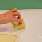 Sam uses a bit of water and rubs her finger into the soap to be tested