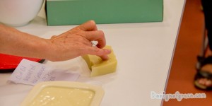 Sam uses a bit of water and rubs her finger into the soap to be tested