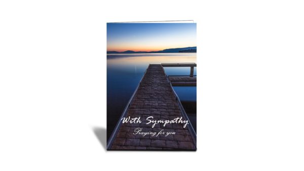 Still waters at Flathead Lake Jetty at sunset with orange and blue colours vertical card with text With Sympathy praying for you